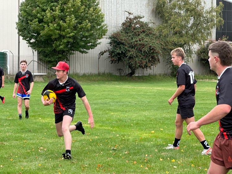 Students playing touch football