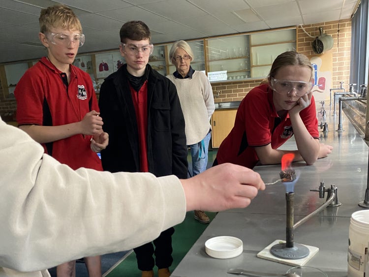 students watching a science experiment demonstration